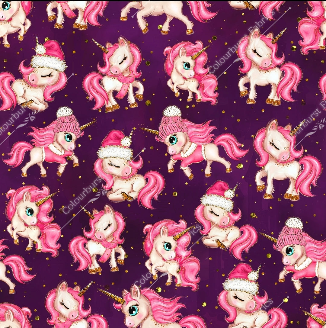 Pink christmas unicorns with gold faux glitter and woolly pom pom hats. Deep purple background. Seamless design for custom fabric printing onto our 22 bases