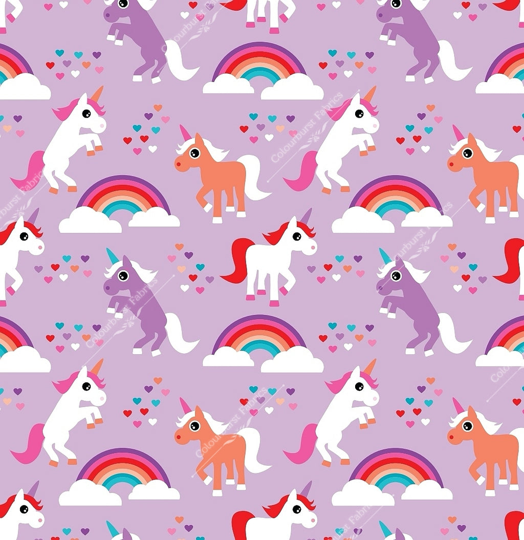 Cute kawaii unicorns with rainbows and love hearts on a lilac background. Seamless design for custom fabric printing onto our 22 bases