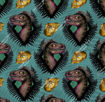 Load image into Gallery viewer, Realistic dinosaur heads in fern border on blue background with fossil in amber. Seamless design for custom fabric printing onto our 22 bases
