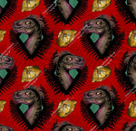 Load image into Gallery viewer, Realistic dinosaur heads in fern border on red background with fossil in amber. Seamless design for custom fabric printing onto our 22 bases
