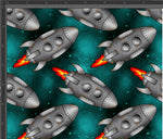 Load image into Gallery viewer, Grey metal rockets with rusted patches and fire flames out the base of the rocket. A galaxy turquoise/teal coloured background. Exclusive design available for pre-order on our 23 bases.
